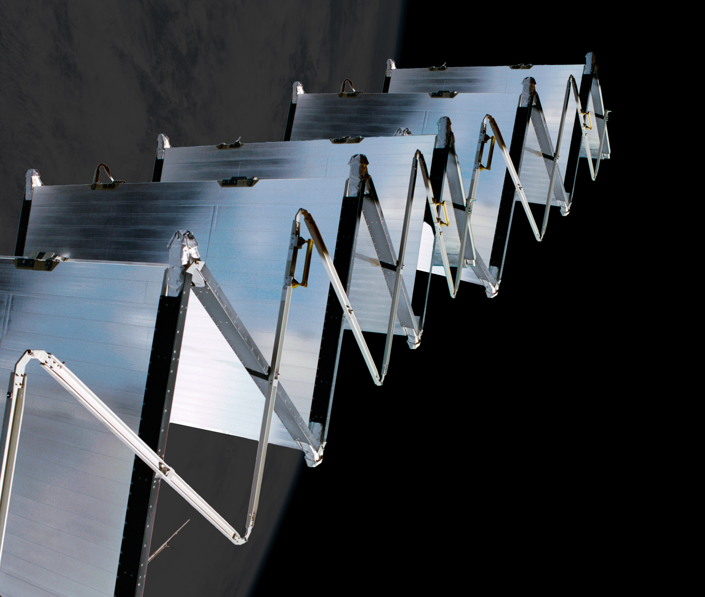 ISS accordion radiator — zig-zag fold pattern with Earth atmosphere